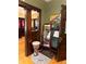 The living room features rich wood trim and artistic accents, including a drum and colorful artwork at 3745 Winthrop Ave, Indianapolis, IN 46205