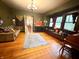 Charming living area with hardwood floors, ample natural light and a decorative rug creating inviting aesthetic at 3745 Winthrop Ave, Indianapolis, IN 46205