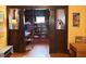 Inviting home office with dark wood trim and built-in shelving adding charm and functional storage at 3745 Winthrop Ave, Indianapolis, IN 46205