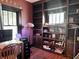 Cozy office space boasts custom built-in shelving, offering a functional and visually appealing workspace at 3745 Winthrop Ave, Indianapolis, IN 46205