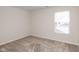 Cozy bedroom showcasing neutral carpet, a large window providing ample natural light, and a fresh, clean aesthetic at 3980 Railhead Ave, Westfield, IN 46074