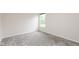 Bedroom with neutral carpet, base trim, window and a neutral color palette at 3980 Railhead Ave, Westfield, IN 46074