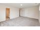 Bedroom featuring neutral colored carpet, base trim, and two entryways at 3980 Railhead Ave, Westfield, IN 46074