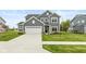 Well-maintained two-story home with gray siding, white trim, and a spacious driveway at 3980 Railhead Ave, Westfield, IN 46074