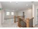 Second floor hallway featuring carpet flooring, wood and metal railing at 3980 Railhead Ave, Westfield, IN 46074
