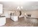 Open living space connecting the kitchen, living room, and staircase with great natural light at 3980 Railhead Ave, Westfield, IN 46074