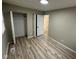 This bedroom features neutral wall paint, vinyl floors, closet, and bright overhead lighting at 4108 Steinmetz Dr, Indianapolis, IN 46254