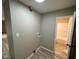 A convenient laundry room features modern flooring and utility connections for washer and dryer at 4108 Steinmetz Dr, Indianapolis, IN 46254