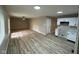 Bright living area with laminate flooring and a seamless transition to the modern kitchen at 4108 Steinmetz Dr, Indianapolis, IN 46254
