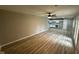 Open-concept living area flowing into the kitchen with modern light-colored flooring at 4108 Steinmetz Dr, Indianapolis, IN 46254