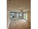 Spacious living room with access to the kitchen and backyard with a fan at 4108 Steinmetz Dr, Indianapolis, IN 46254