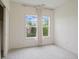 Bright, carpeted bedroom with a large window and white walls, creating a cozy and serene space at 4261 Washington Blvd, Plainfield, IN 46168