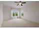 Bright, carpeted bedroom with two large windows offering ample natural light and view at 4261 Washington Blvd, Plainfield, IN 46168