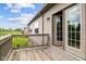 This deck features a wood floor and sliding glass doors at 4261 Washington Blvd, Plainfield, IN 46168