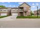 Charming two-story condo with brick and vinyl siding, attached garage, and small front balcony at 4261 Washington Blvd, Plainfield, IN 46168