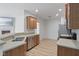 Bright kitchen with stainless steel appliances, light counter tops, and hardwood flooring at 4261 Washington Blvd, Plainfield, IN 46168
