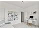 Bright bedroom with a desk, artwork and a comfortable daybed with white walls at 4428 Maldenhair Dr, Indianapolis, IN 46239