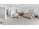 Bright bedroom features plush carpet, vaulted ceiling, and elegant decor with a walk in closet and seating area at 4428 Maldenhair Dr, Indianapolis, IN 46239
