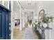 Bright entryway features light hardwood floors, sliding barn door and stylish console table at 4428 Maldenhair Dr, Indianapolis, IN 46239