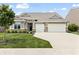 Charming single-story home with a well-manicured lawn, a two-car garage, and a welcoming entrance at 4428 Maldenhair Dr, Indianapolis, IN 46239