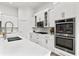 Contemporary kitchen featuring stainless steel appliances, a large island with seating, and plenty of cabinet storage at 4428 Maldenhair Dr, Indianapolis, IN 46239