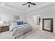 This spacious main bedroom offers an en-suite bath and a calming color palette at 4428 Maldenhair Dr, Indianapolis, IN 46239