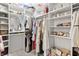 Well-organized walk-in closet maximizes space with shelves, rods, and baskets for efficient storage at 4428 Maldenhair Dr, Indianapolis, IN 46239