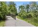 A scenic walking path with a wooden bridge surrounded by lush greenery at 4428 Maldenhair Dr, Indianapolis, IN 46239