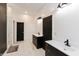 Modern bathroom with double vanity, sleek fixtures, and beautiful tile flooring at 4457 E County Road 850 N, Pittsboro, IN 46167