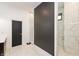 Modern bathroom featuring a frameless shower with grey accent wall at 4457 E County Road 850 N, Pittsboro, IN 46167