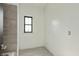 Unfinished bathroom with updated shower tiling and new fixtures at 4457 E County Road 850 N, Pittsboro, IN 46167