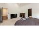 Spacious bedroom featuring neutral carpet, rolltop desk and large television at 4457 E County Road 850 N, Pittsboro, IN 46167