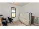 Bedroom featuring a double window with a green view and an unfinished floor at 4457 E County Road 850 N, Pittsboro, IN 46167
