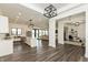 Open floor plan with kitchen island, stainless steel appliances, and eat-in kitchen at 4457 E County Road 850 N, Pittsboro, IN 46167