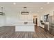 Modern kitchen with white cabinets, stainless steel appliances and large center island at 4457 E County Road 850 N, Pittsboro, IN 46167
