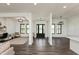 Bright, open living space with wood floors and abundant natural light from large windows at 4457 E County Road 850 N, Pittsboro, IN 46167
