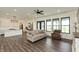 Open-concept living room with hardwood floors and kitchen views at 4457 E County Road 850 N, Pittsboro, IN 46167