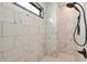 Elegant shower featuring white marble style tiling and bronze fixtures at 4457 E County Road 850 N, Pittsboro, IN 46167