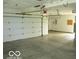 Spacious garage featuring a clean cement floor and white doors at 4667 Sundance Trl, Indianapolis, IN 46239