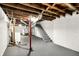Unfinished basement with painted concrete walls, exposed ceiling and utilities at 5104 Carvel Ave, Indianapolis, IN 46205