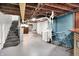Unfinished basement with exposed ceiling, concrete floor, laundry area, and storage space at 5104 Carvel Ave, Indianapolis, IN 46205