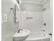 Clean bathroom with tiled walls, modern fixtures, and a pedestal sink at 5104 Carvel Ave, Indianapolis, IN 46205