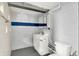 Basement bathroom featuring a modern vanity, toilet, and painted walls at 5104 Carvel Ave, Indianapolis, IN 46205