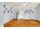 Bedroom with hardwood floors and light blue walls, with modern acoustic tiles at 5104 Carvel Ave, Indianapolis, IN 46205