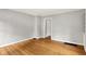 Neutral tone bedroom with updated hardwood floors, and fresh paint at 5104 Carvel Ave, Indianapolis, IN 46205