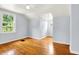 Bright bedroom with hardwood floors, angled ceilings and two large windows at 5104 Carvel Ave, Indianapolis, IN 46205