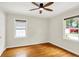 Bedroom with hardwood floors and large windows offering plenty of natural light at 5104 Carvel Ave, Indianapolis, IN 46205