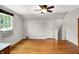 Bedroom features hardwood floors, a ceiling fan and natural light from the window at 5104 Carvel Ave, Indianapolis, IN 46205