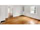 Bedroom features refinished hardwood floors, and a big window at 5104 Carvel Ave, Indianapolis, IN 46205