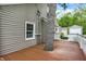 Spacious wooden deck built around a mature tree, adding natural charm at 5104 Carvel Ave, Indianapolis, IN 46205